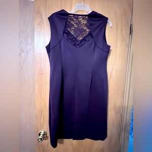 Knee length purple sleeveless fitted dress with lace detail on the back size18